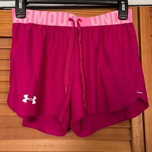 Women’s fuchsia Under Armour athletic shorts
